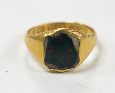 A George V 18ct gold and bloodstone set signet ring, size M, gross weight 4.1 grams. Condition - poor